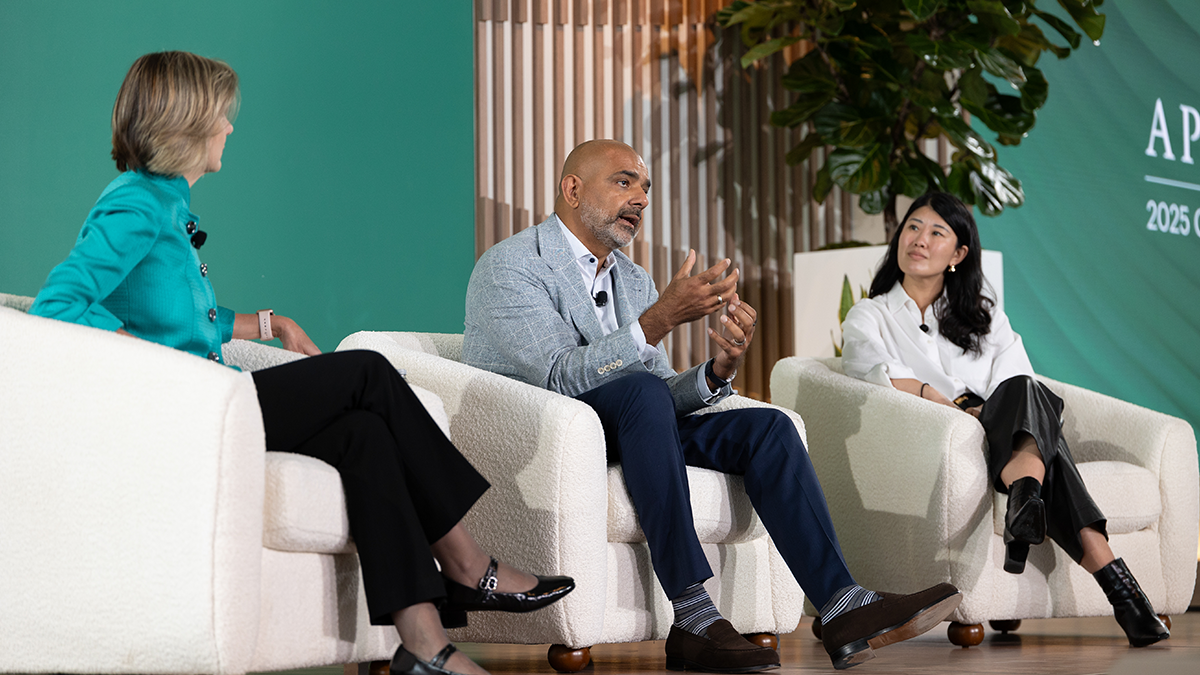 Three executives seated onstage in discussion during the 2025 Apollo CEO Conference, highlighting collaboration across operations, capital solutions, and strategic leadership