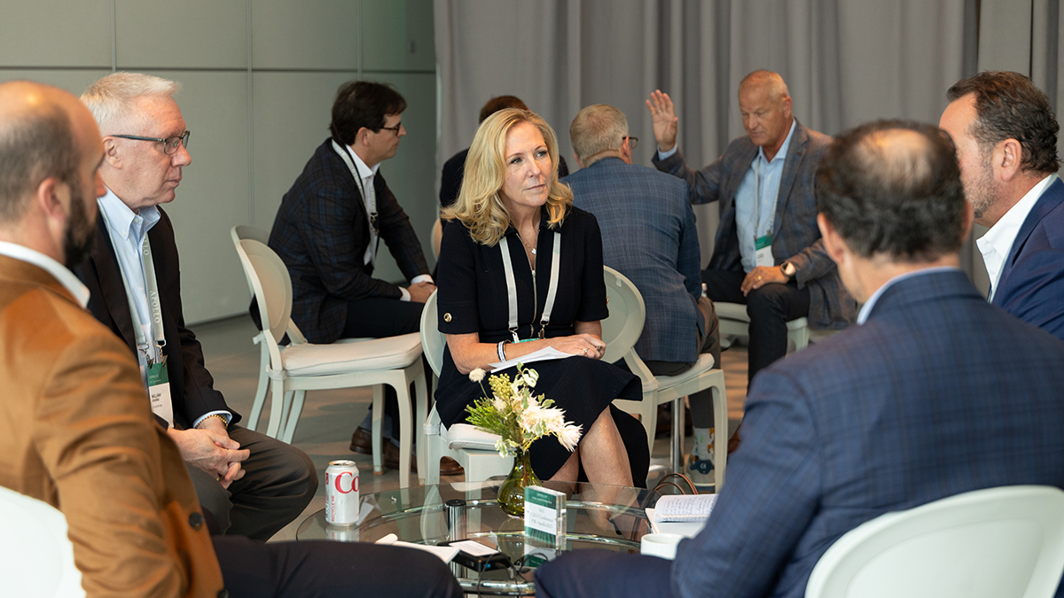Executives seated in small discussion groups during the 2025 Apollo CEO Conference, engaging in collaborative dialogue around leadership, transformation, and performance.